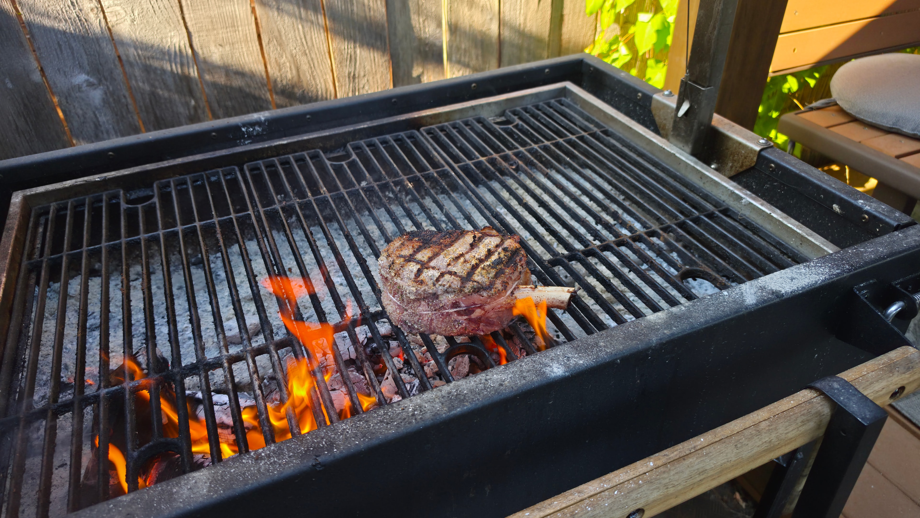 Steak grilling over open flames
