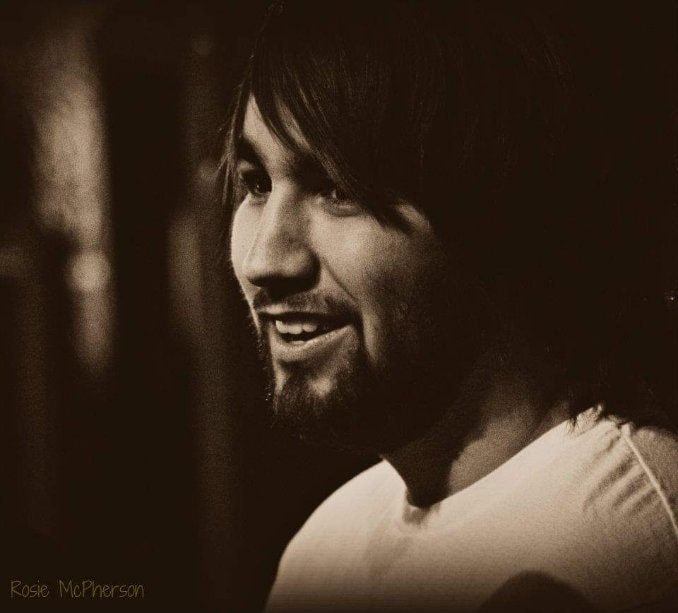 Sepia portrait of a young man smiling