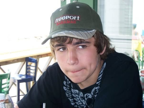 Teenage boy wearing a Freeport Bahamas cap