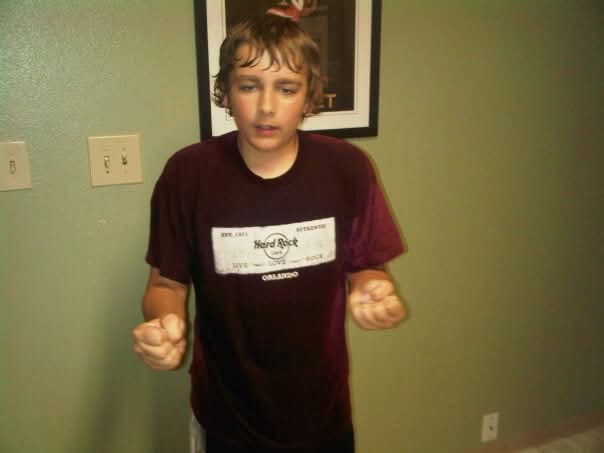 Teenage boy in a Hard Rock Cafe Orlando shirt